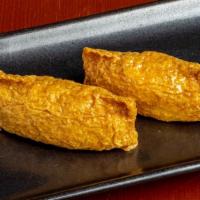 Inari · Rice wrapped in a fried tofu.