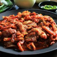 Osam Bulgogi 오삼불고기 · Stir-fried squid and pork belly with vegetables in spicy sauce.