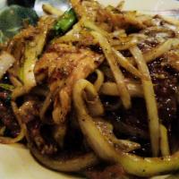 Mongolian Triple Delight · Chicken, beef, shrimp and bell peppers, cooked in a spicy & sour brown sauce spicy chef's sp...