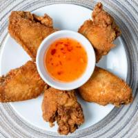 Chicken Wings · Cooked wing of a chicken coated in sauce or seasoning.