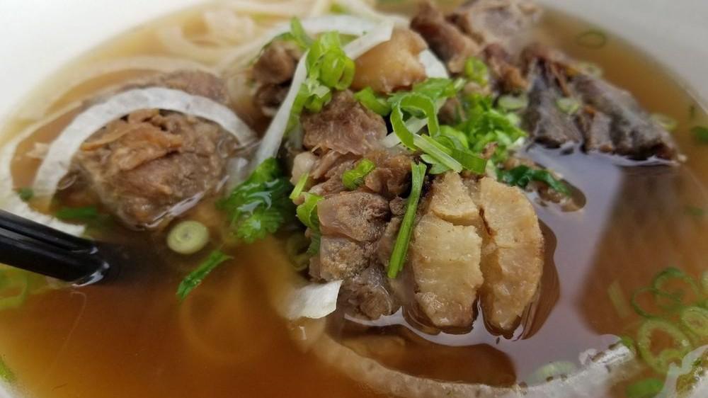 Pho Beef · Slices of round steak and lean brisket with rice stiick noodles, topped with onions and cilantro