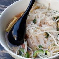 Pho Chicken · Mixed dark and white meat chicken with rice stick noodles, topped with onions, cilantro, and...