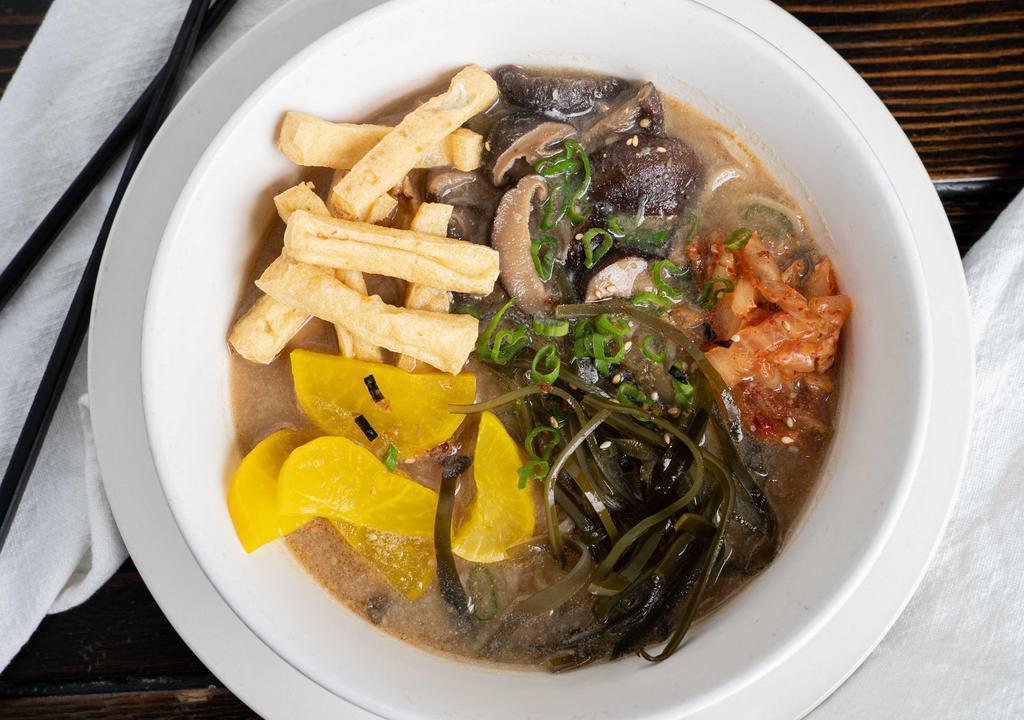 Buddha Ramen · Fried tofu, pickled spiced daikon kim chee, seaweed, shitake mushroom, dash of sesame oil in a miso broth.