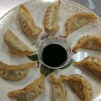 Potstickers · 10 pieces. Everyone's favorite! Ten pork and vegetable dumpling potstickers served with our ...