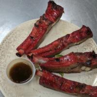 Barbecued Spare Ribs · 4 pieces. Four Chinese roasted pork ribs. Served with our tangy rib sauce.