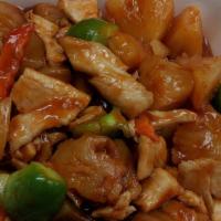 Pineapple Chicken · Pineapple, chicken stir fried in a tangy, sweet, and sour sauce. Served with steamed rice.