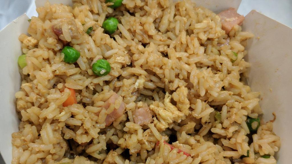 Yang Chow Fried Rice · Peas and carrots, ham, pork and shrimp.