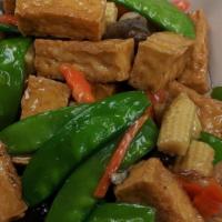 Braised Tofu · Served with steamed rice. Tofu, snow peas, baby corn, and straw mushrooms.