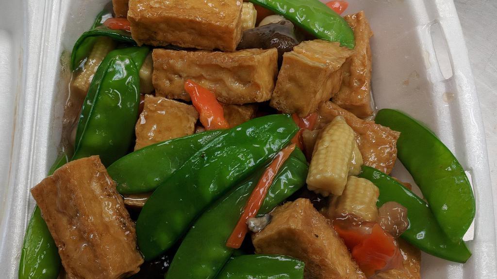 Braised Tofu · Served with steamed rice. Tofu, snow peas, baby corn, and straw mushrooms.