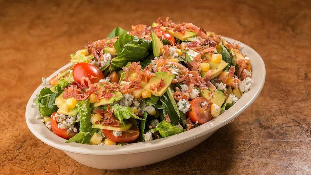 Blt Chopped Salad · Who needs a sandwich? Bacon, avocado, grape tomatoes on a bed of chopped romaine lettuce and topped with blue cheese crumbles and served with your choice of dressing.
