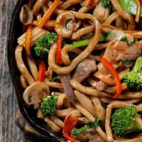 Beef Udon · Udon noodles stir fried with soy sauce, braised thin sliced ribeye beef and vegetables.