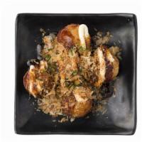 Takoyaki · Deep-fried minced octopus topped with Japanese mayo, savory sauce & fish flakes