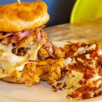 Cordon 'Wich · Fried chicken, ham, swiss, chipotle honey butter, and a buttermilk biscuit. Served with hash...