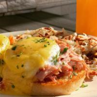 Old School Benedict · Two poached eggs, ham, and hollandaise on an English muffin. Served with hashbrowns.