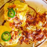 Tijuana Benedict · Two poached eggs, adobo pork shoulder, black bean puree, fresh jalapeños, pico, and chipotle...