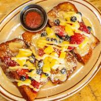 # Bread Pudding (Style) French Toast · House butter, fresh challah bread, white chocolate, cream cheese icing, seasonal fruit, powd...