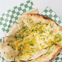 Topped Naan · Lightly buttered and sprinkled with your choice of onion & cilantro or garlic & basil.
