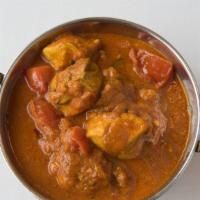 Madras · A subtly-balanced tomato based curry with sauteed tomato chunks, garlic, spices, and red chi...