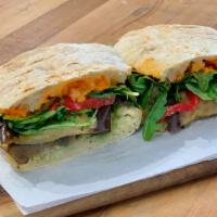 Eggplant Superfood Sandwich (Vegan) · Roasted eggplant, house almond ricotta, roasted red pepper, arugula, house *romesco sauce & ...