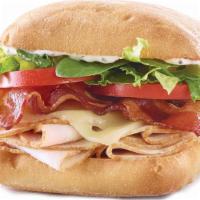 Turkey Bacon Ranch · Turkey, Swiss, bacon, tomatoes, a romaine spinach blend & light ranch dressing on a ciabatta.