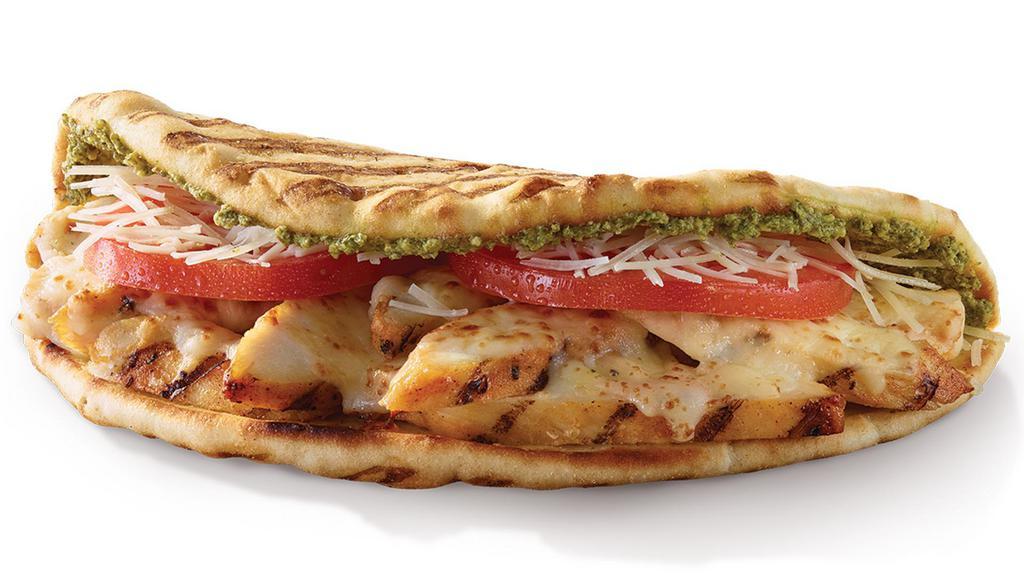 Chicken Pesto · Grilled chicken, tomatoes, parmesan, low-fat mozzarella & pesto on a toasted flatbread.