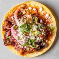 El Diablo Taco · Pork belly and roasted poblano peppers, queso fresco, cabbage slaw, verde, and plantain sauc...