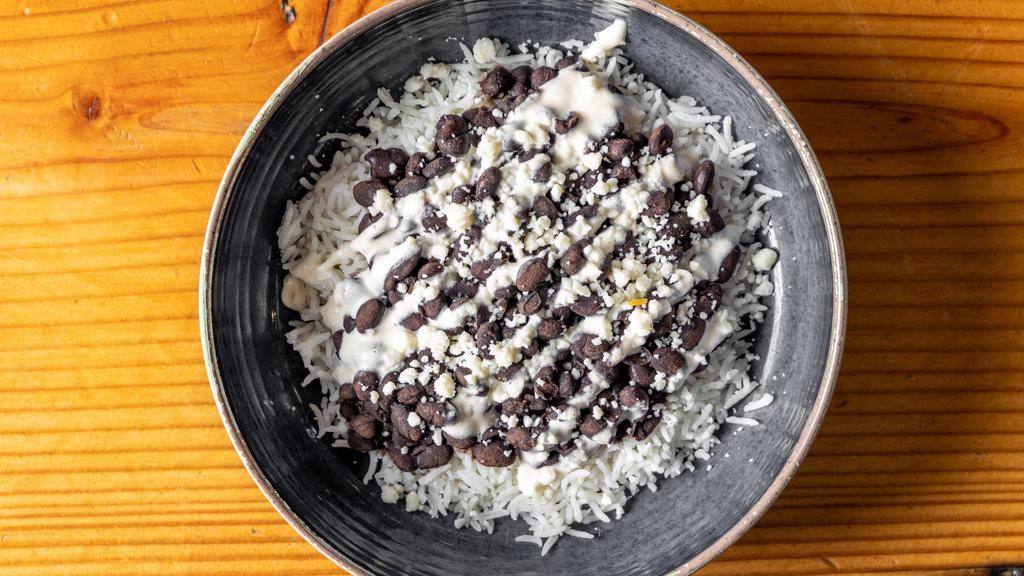 Niños Bowl · Black beans and basmati rice with queso fresco and crema. Can add guacamole, protein, salsa.
