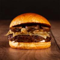 The Mushroom Swiss Cheeseburger · Beef patty, roasted mushrooms, caramelized onions, melted swiss cheese, and mayo on a brioch...