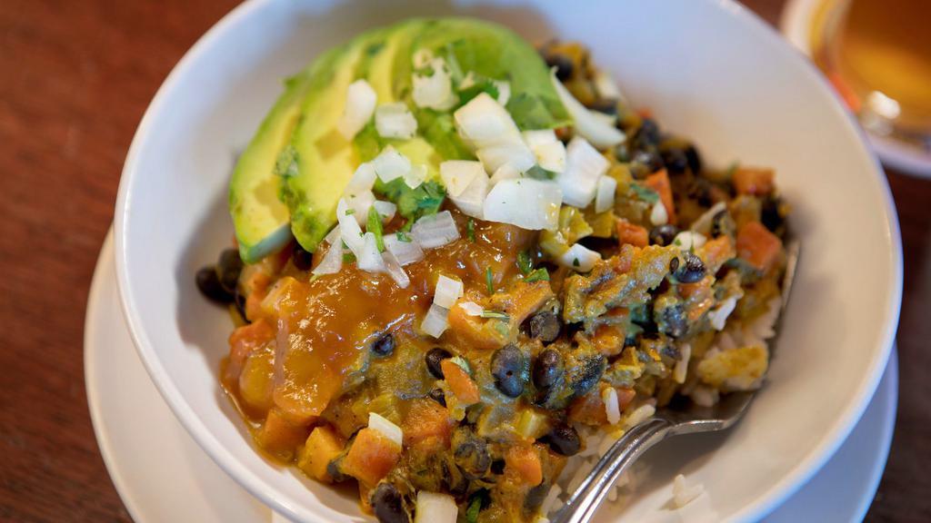 Baja Bowl · Black beans, rice, avocado, cheddar cheese, chipotle pico de gallo, cilantro sour cream and tortilla strips topped with an onion, jalapeno, cilantro condiment. Vegetarian.