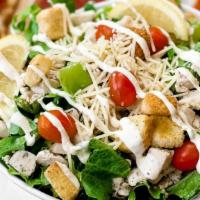 Grilled Chicken Caesar Salad · Chicken Caesar salad is served with creamy Caesar dressing, croutons, grape tomatoes, grille...