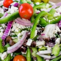 Greek Salad · Greek salad is served with croutons, feta, grape tomatoes, Greek dressing, green peppers, ka...