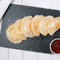 Stir-Fried House Made Chicken Dumpling (6 Pieces) · Served with House special sweet spicy sauce .