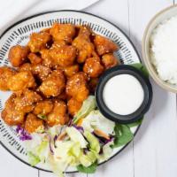 Sesame Chicken · Served with Rice and Salad.