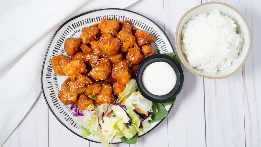 Sesame Chicken · Served with Rice and Salad.