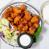 General Tso Chicken · Served with Rice and Salad.