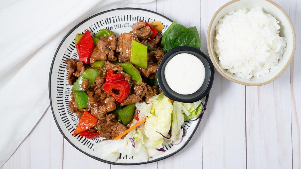 Mongolian Beef · Served with Rice and Salad.