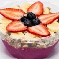 Hawaiian · Organic pitaya, pomegranate juice, strawberries, bananas topped with: granola, coconut, hone...