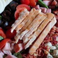 Cobb Salad · chopped romaine lettuce, ham, chicken, bacon, crumbled bleu cheese, olives, tomatoes, hard-b...