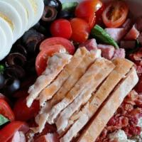 Half Cobb Salad · chopped romaine lettuce, ham, chicken, bacon, crumbled bleu cheese, olives, tomatoes, hard-b...