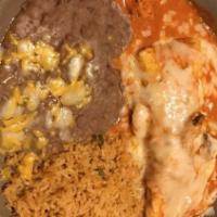 Burrito Chipotle · Made with flour tortilla stuffed with chunks of chicken sautéed with mushrooms in a creamy c...