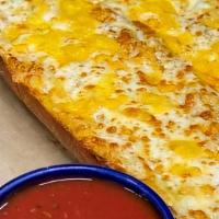Cheesy Garlic Bread Loaf  · French bread loaf covered in garlic butter, mozzarella, and cheddar cheese. Served with mari...