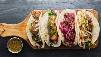 Carnitas Tacos · Gluten-free. Slow roasted michoacán style pork carnitas, pickled red onions, avocado crema, ...