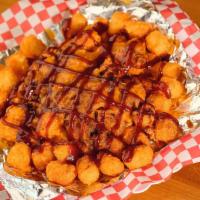 Bbq Pork Loaded Tots · Tots topped with smoked BBQ Pork, BBQ Sauce and shredded cheddar