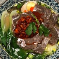Home-Style Thin Sliced Beef Spicy Rice Noodle Soup酱香牛肉麻辣米线 · Spicy. Served with braised egg, bok choy on the top.