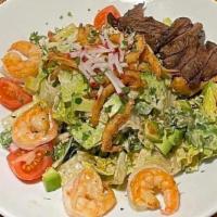 Surf & Turf Salad · Grilled Skirt Steak, Garlic Shrimp, Mixed Lettuce, Avocado, Campari Tomato, Cucumber, Crispy...