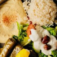 Dolmas Plate · Vegetarian, gluten-free. 7 dolmas come with hummus, rice, and tzatziki sauce and feta cheese...