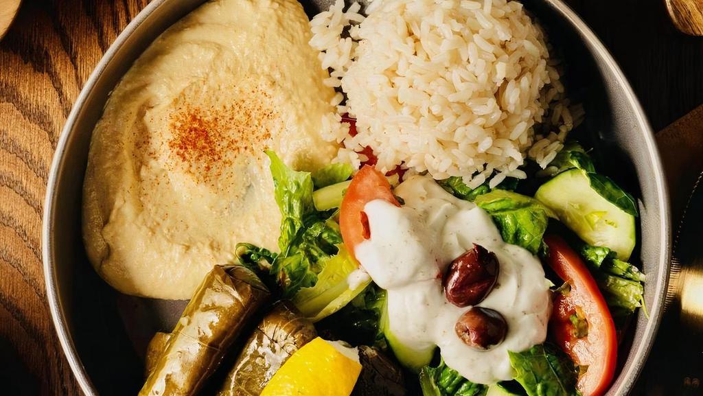 Dolmas Plate · Vegetarian, gluten-free. 7 dolmas come with hummus, rice, and tzatziki sauce and feta cheese salad.