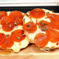 Pizza Bagel · A fresh large bagel sliced and prepared with organic pizza sauce and mozzarella cheese.