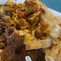Cheese Steak · Seasoned grilled steak topped with melted American cheese and fresh grilled onions.