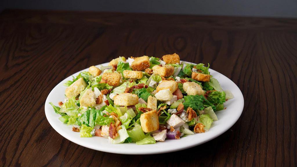 Chopped Salad · Romaine lettuce, pasta, chicken, bacon, gorgonzola, red onion, green pepper, grape tomatoes, croutons.